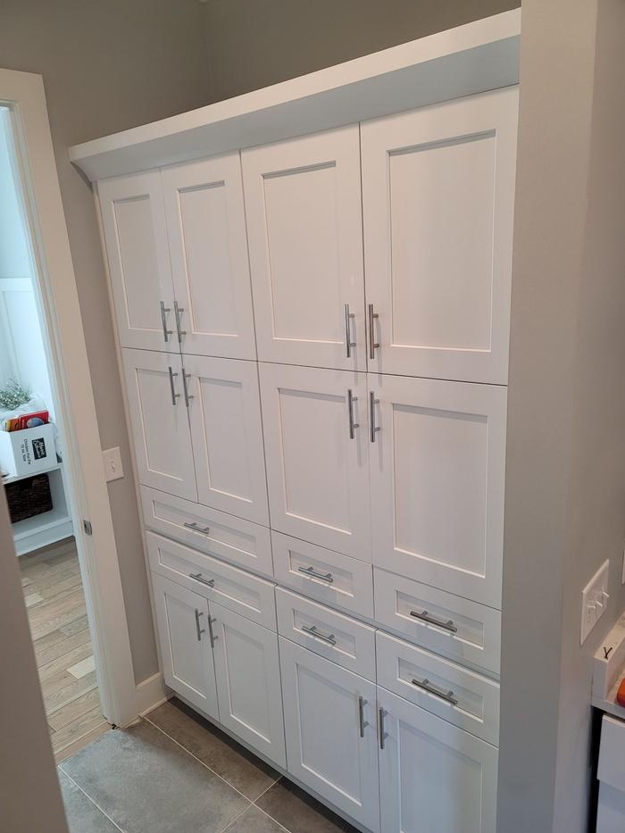Built-in white pantry cabinets